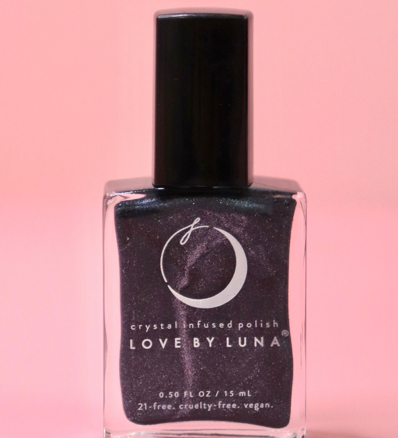 The Scorpio Zodiac Nail Polish with Micronized Obsidian on a pink background.