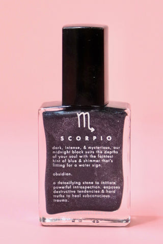 The Scorpio Zodiac Nail Polish with Micronized Obsidian on a pink background.