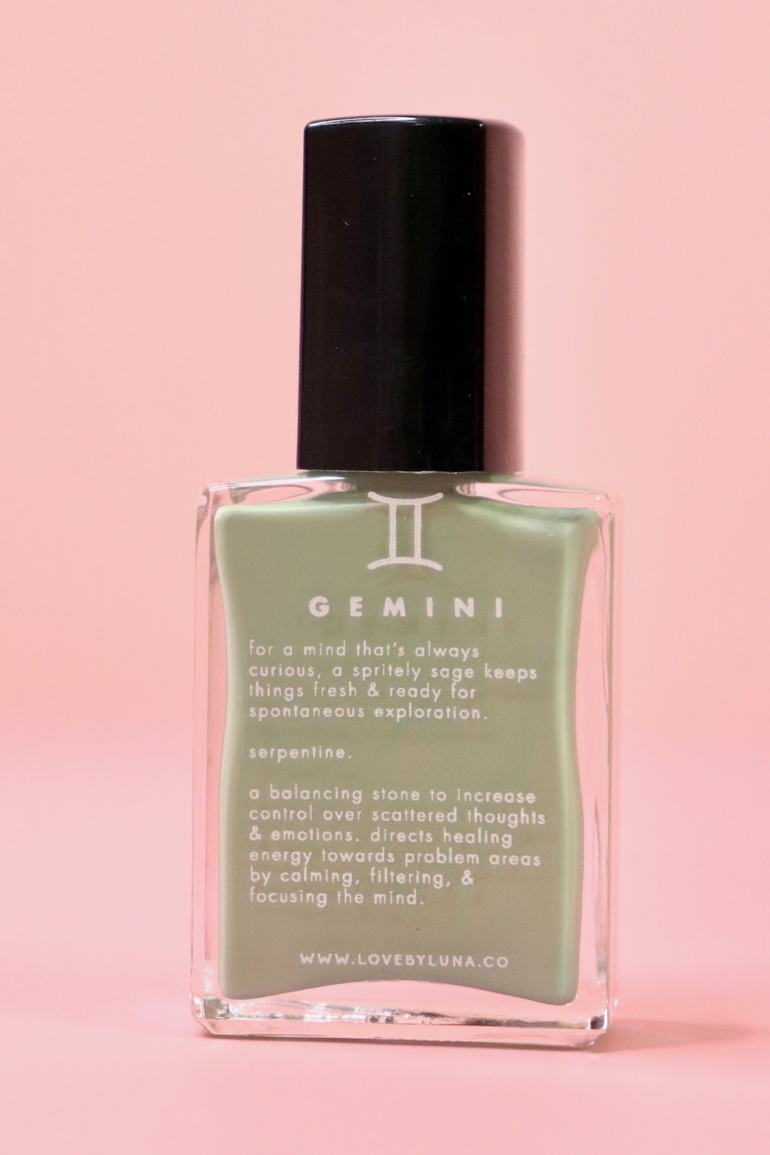  The Gemini Zodiac Nail Polish with Micronized Serpentine on a pink background.