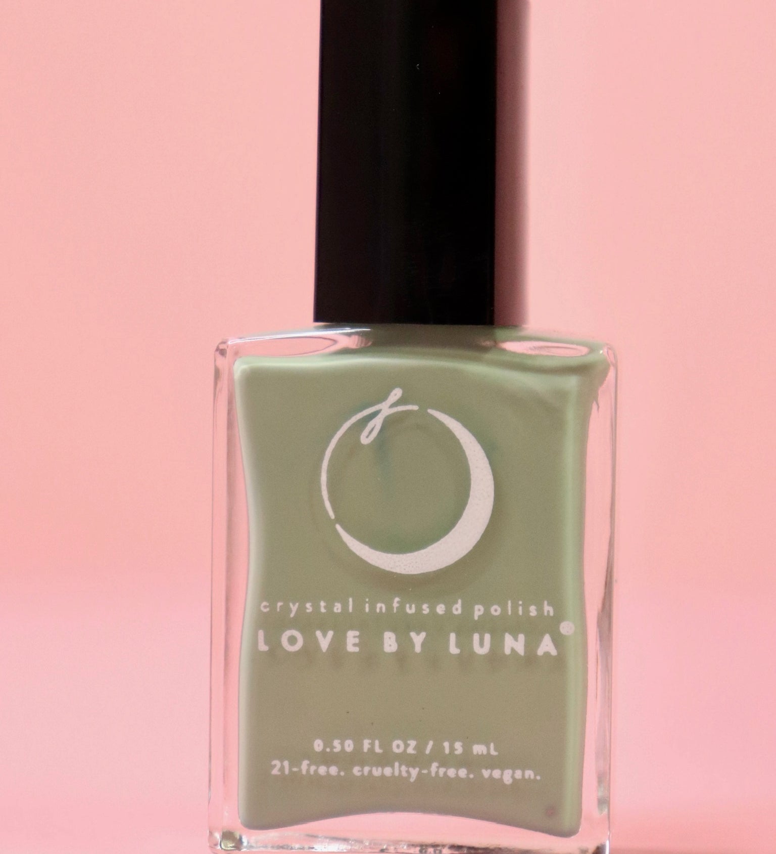  The Gemini Zodiac Nail Polish with Micronized Serpentine on a pink background.