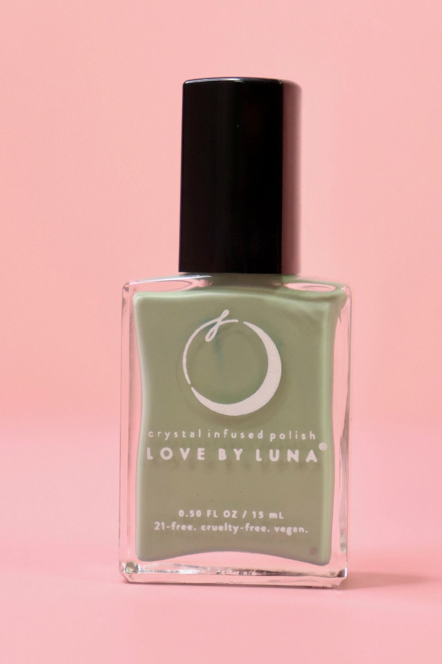  The Gemini Zodiac Nail Polish with Micronized Serpentine on a pink background.