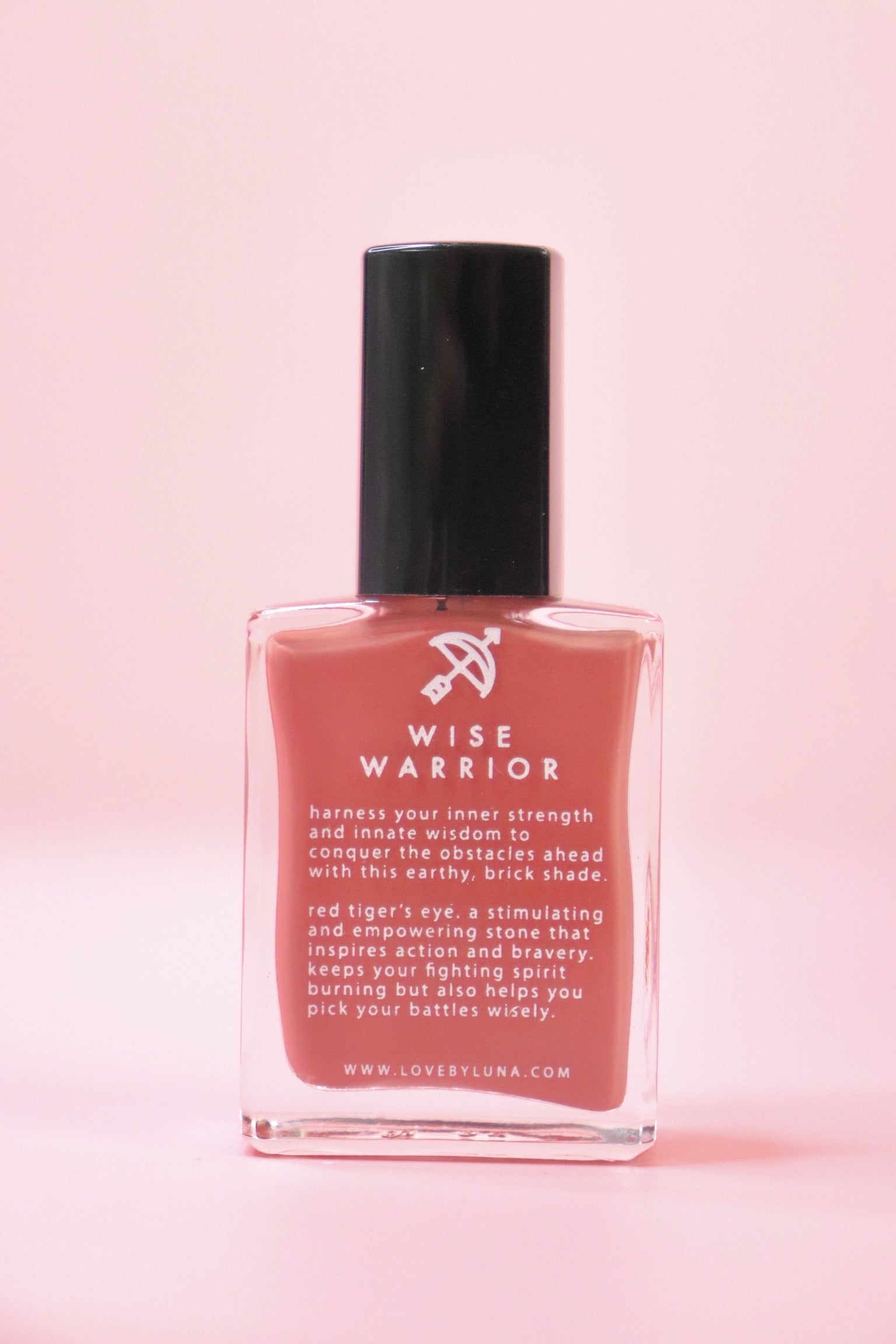 The Wise Warrior Nail Polish with Micronized Tiger's Eye on a pink background.