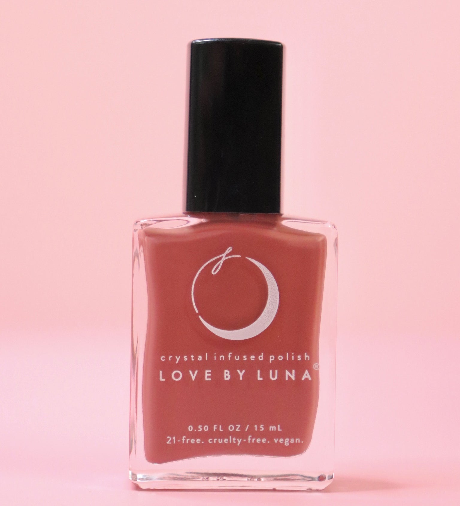 The Wise Warrior Nail Polish with Micronized Tiger's Eye on a pink background.