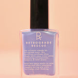 The Retrograde Rescue Nail Polish with Micronized Blue Lace Agate on a pink background.
