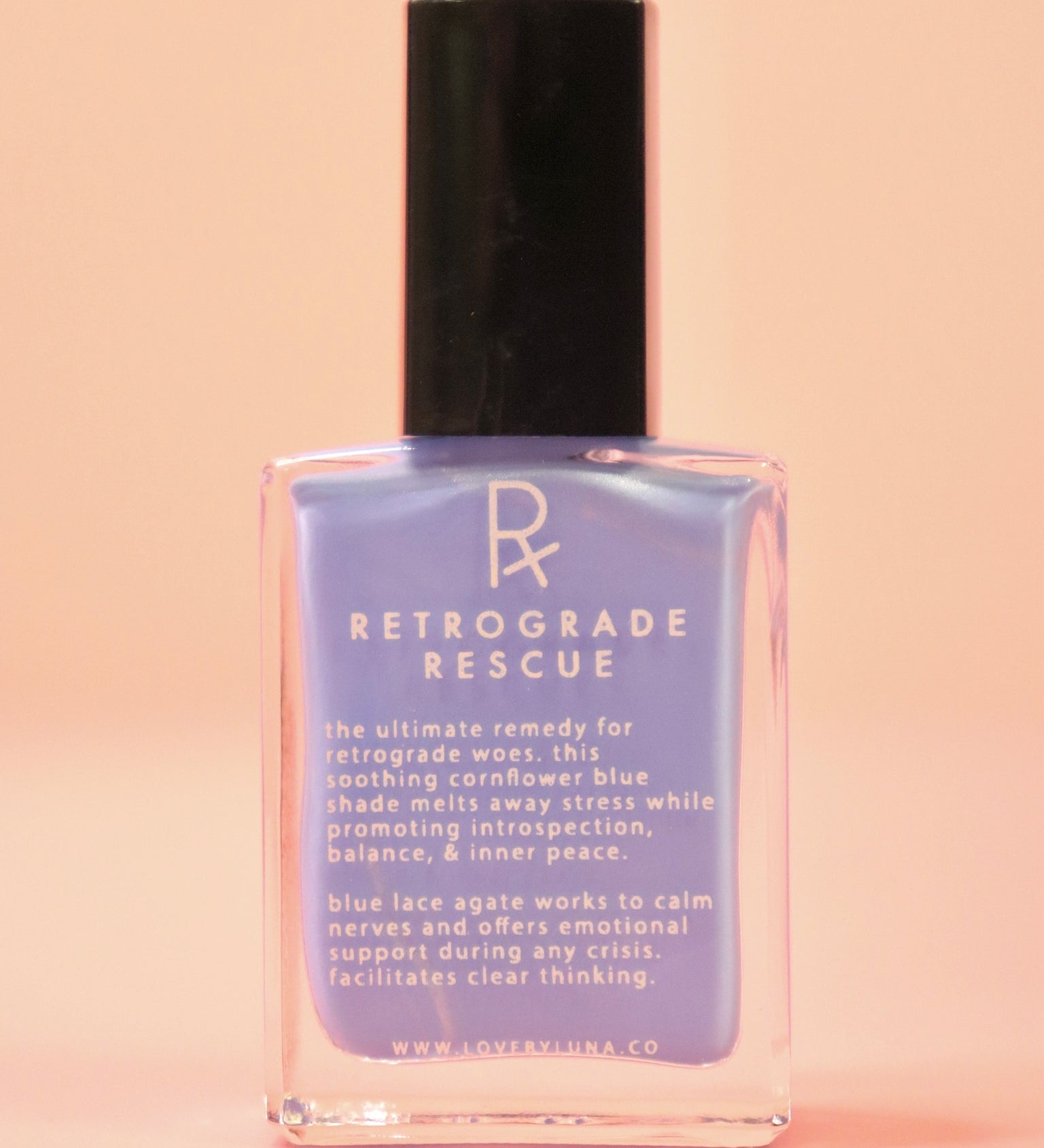 The Retrograde Rescue Nail Polish with Micronized Blue Lace Agate on a pink background.