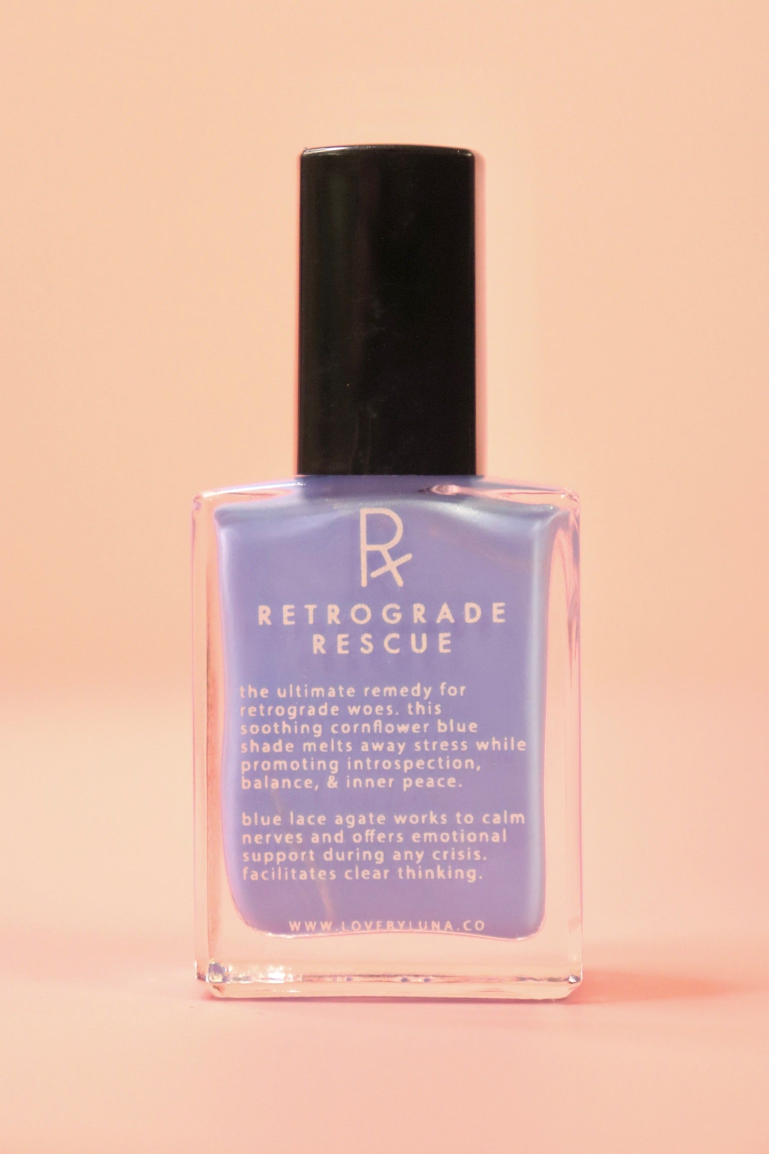 The Retrograde Rescue Nail Polish with Micronized Blue Lace Agate on a pink background.