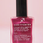 The Sagittarius Zodiac Nail Polish on a pink background.