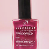 The Sagittarius Zodiac Nail Polish on a pink background.