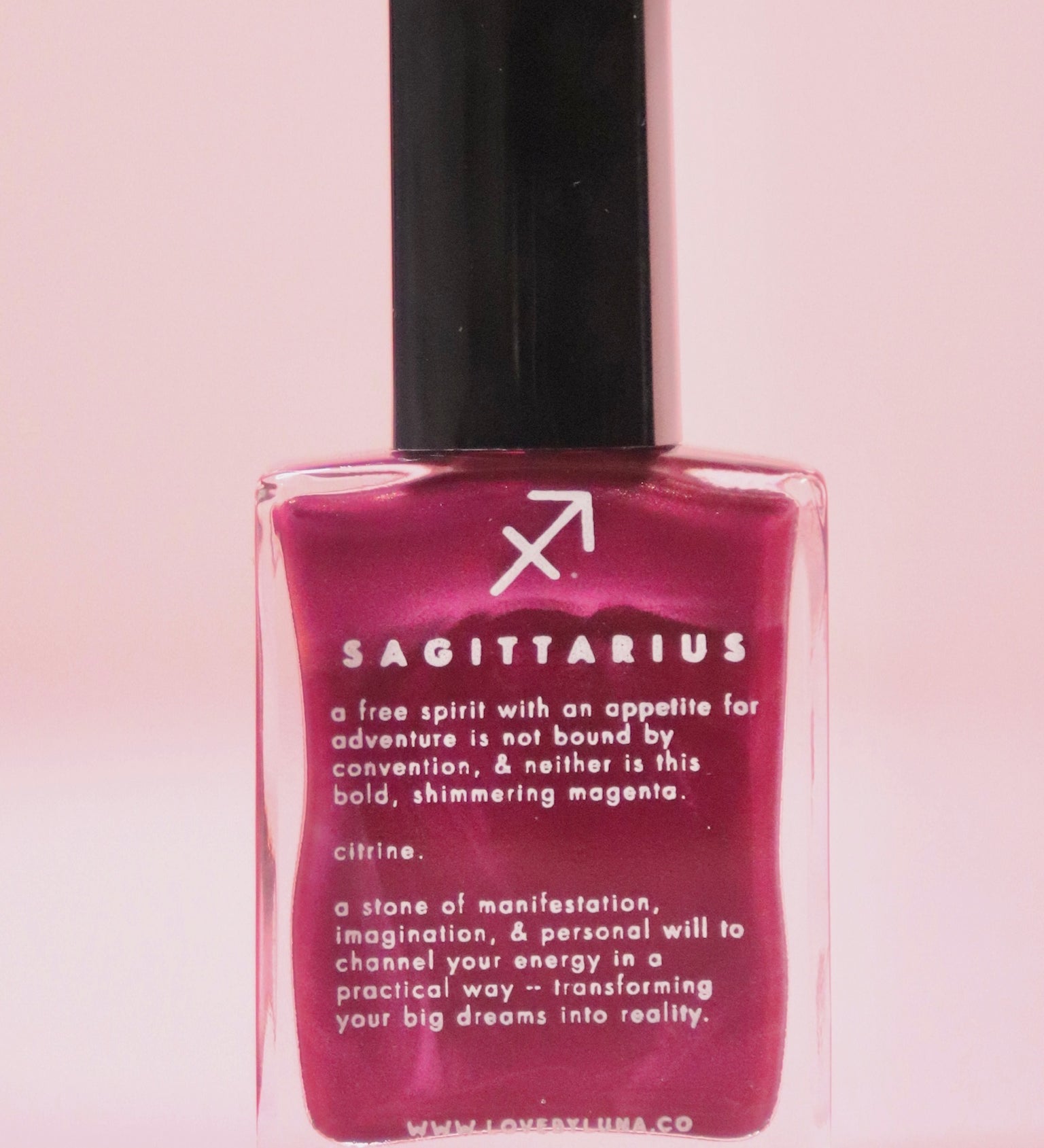 The Sagittarius Zodiac Nail Polish on a pink background.