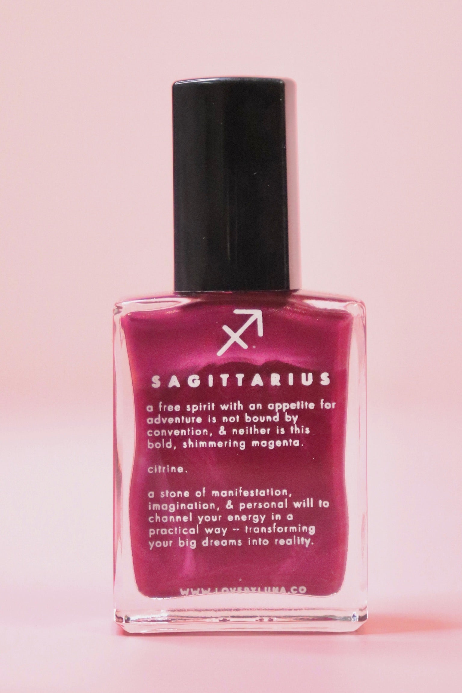 The Sagittarius Zodiac Nail Polish on a pink background.
