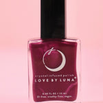 The Sagittarius Zodiac Nail Polish on a pink background.