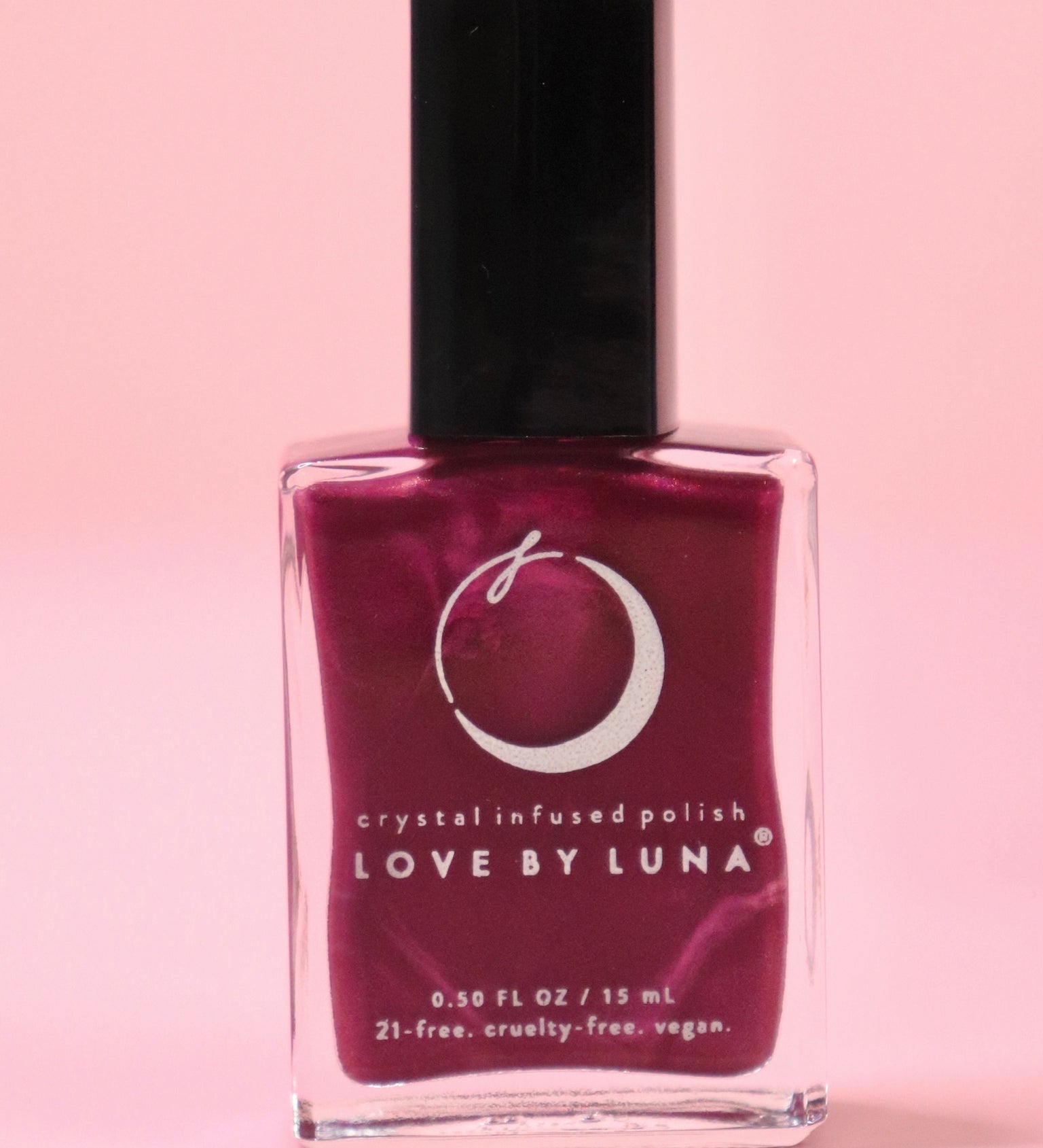 The Sagittarius Zodiac Nail Polish on a pink background.