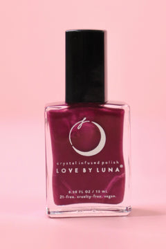 The Sagittarius Zodiac Nail Polish on a pink background.