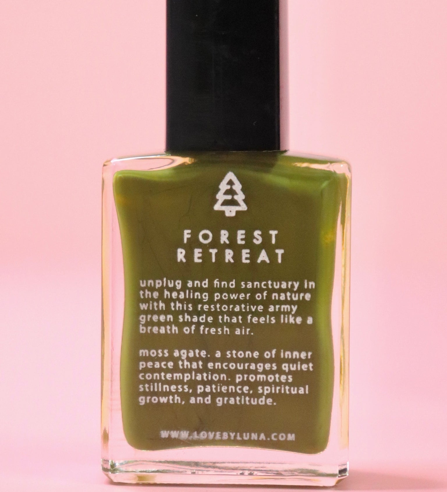 The Forest Retreat Nail Polish with Micronized Moss Agate on a pink background.