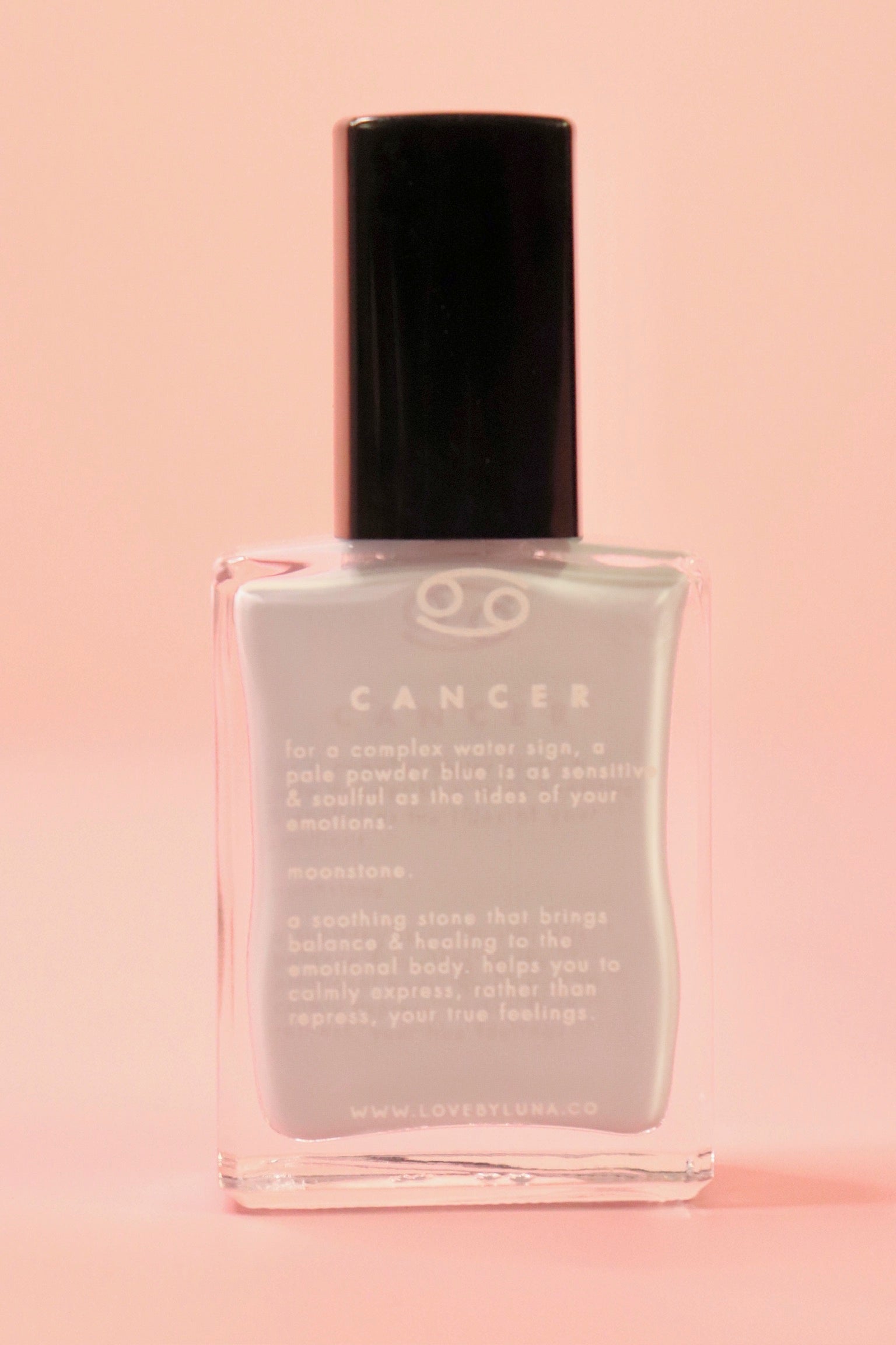 The Cancer Zodiac Nail Polish with Micronized Moonstone on a pink background.