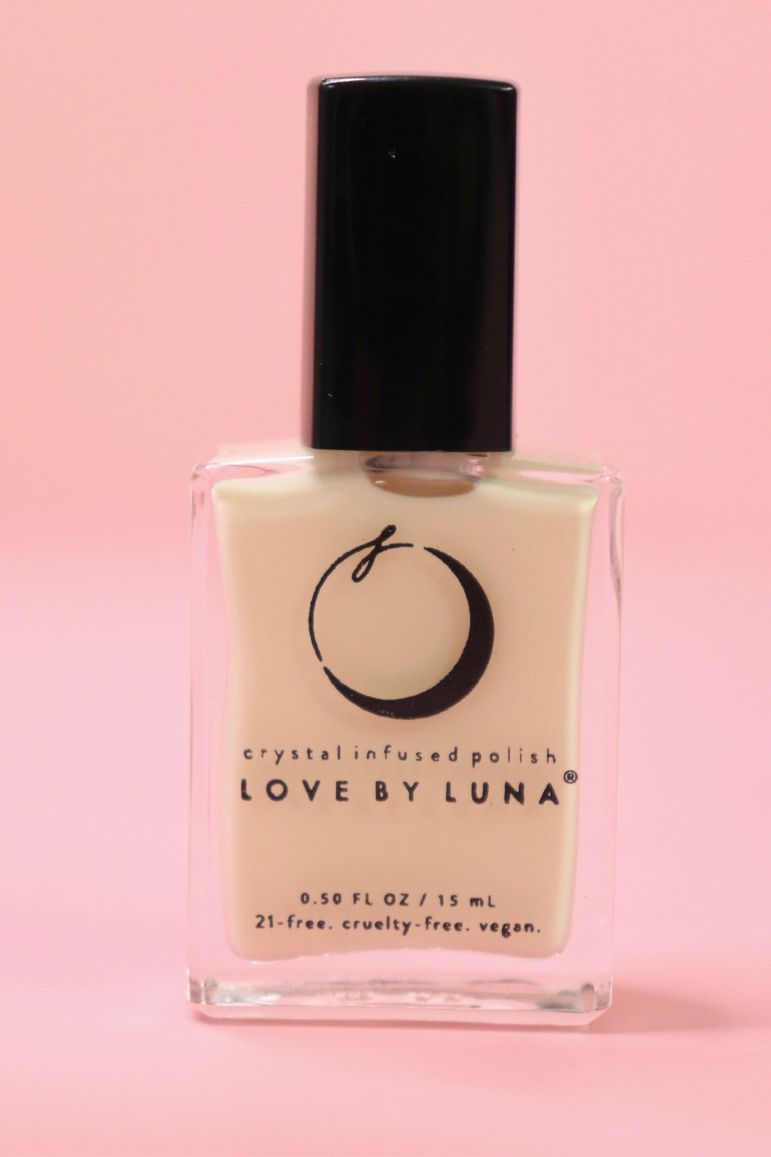 The Goddess Nail Polish with Micronized Rose Quartz, Selenite, & Moonstone on a pink background.