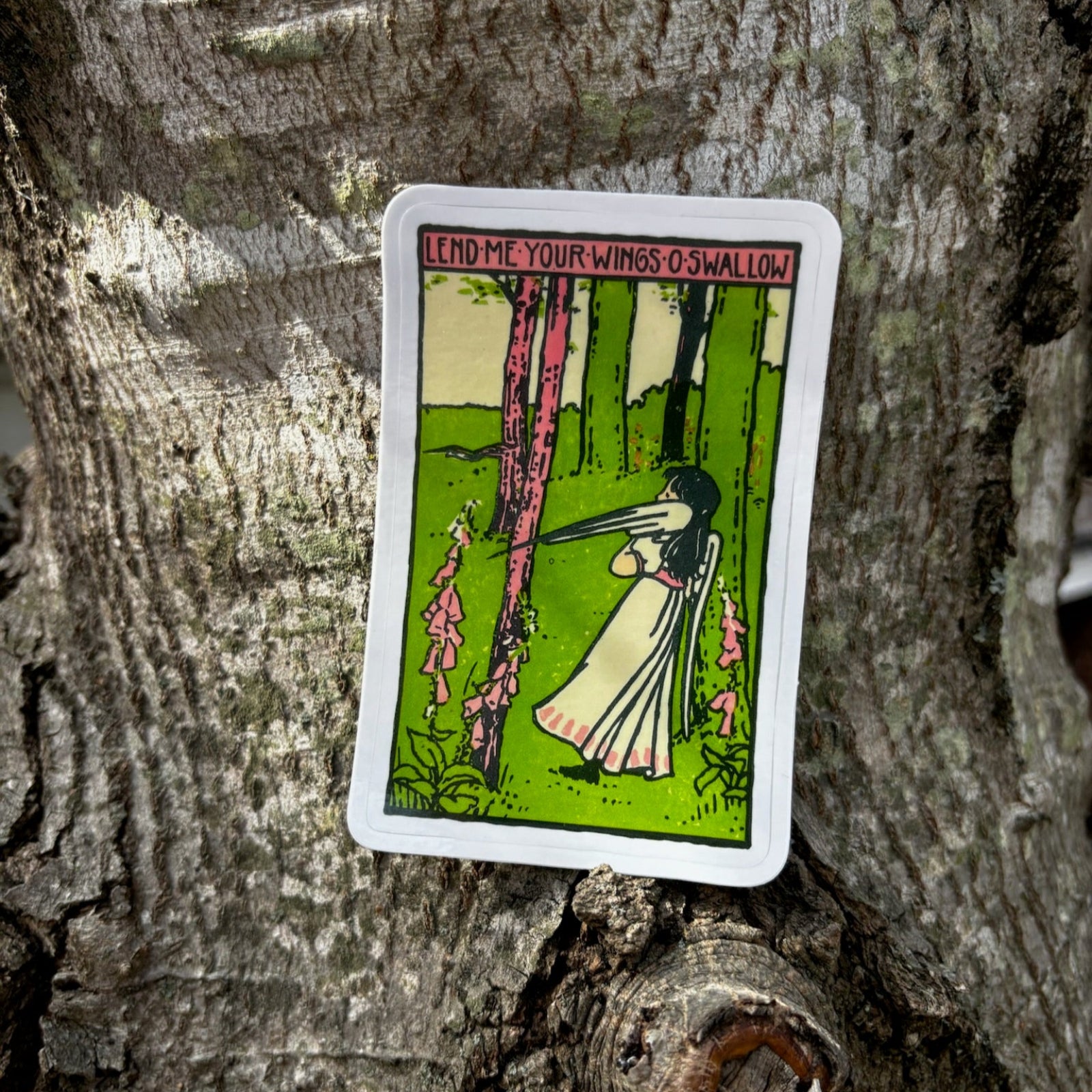 The Lend Me Your Wings O Swallow 3 Inch Sticker on a tree.