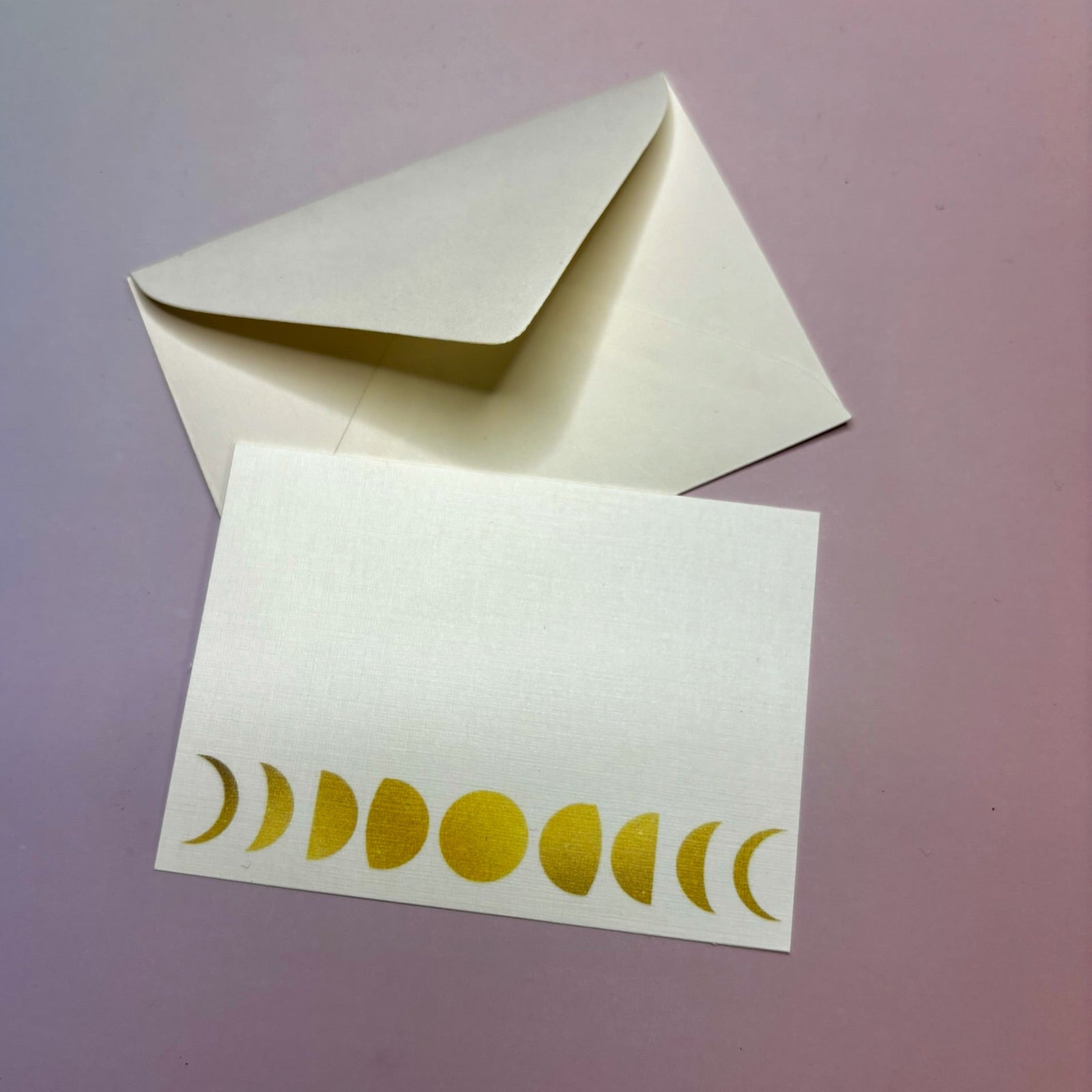 The Moon Phases Mini Card on a purple background.