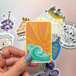 One of the mystery stickers being held in front of other stickers.