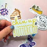 One of the mystery stickers being held in front of other stickers.
