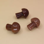 3 Mini Crystal Gemstone Mushrooms on orange background