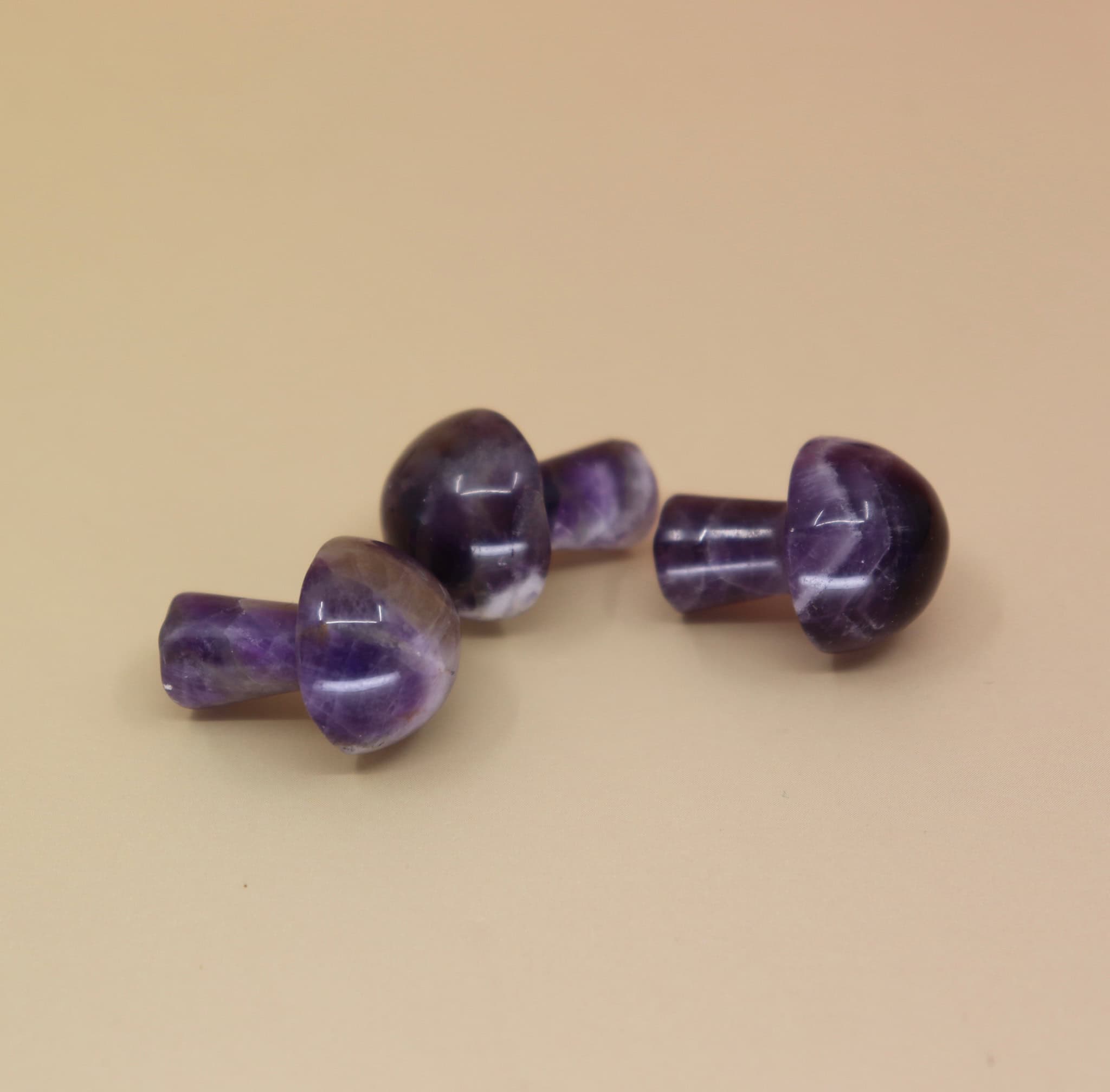 3 Mini Crystal Gemstone Mushrooms on orange background