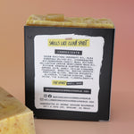 Two of the Buzz Love - Restorative Honey Oat Soaps on a peach-colored background.