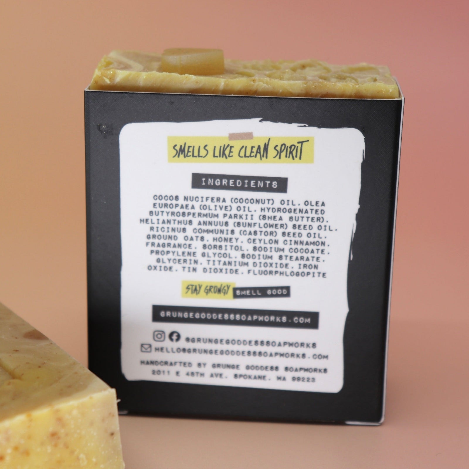 Two of the Buzz Love - Restorative Honey Oat Soaps on a peach-colored background.