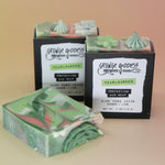 Three of the Pearlgarden - Protecting Aloe Vera Soaps on a peach-colored background.