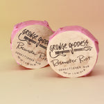 Two of the Rosewater Riot - Conditioner Bars on a peach-colored background.
