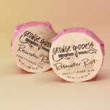 Two of the Rosewater Riot - Conditioner Bars on a peach-colored background.