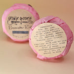 Two Rosewater Riot - Shampoo Bars, one showing the back of the packaging all on a peach-colored background.