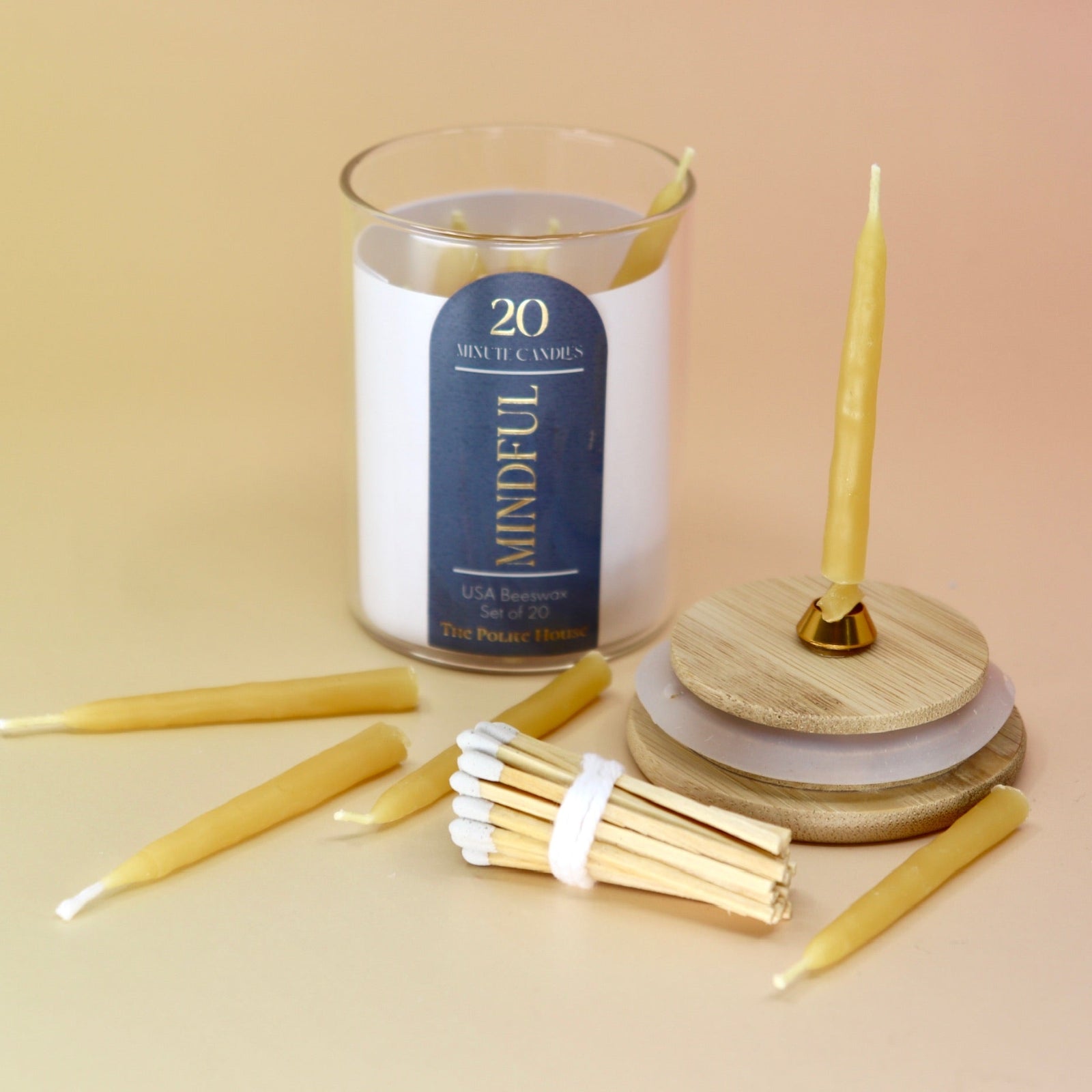 The 20 Minute Beeswax Candle Set: Mindful (Set of 20) on a light pink background.