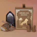 The Creative Imagination Incense Cones box next to two crystal pieces next to it with two incense cones in front of it.