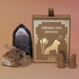 The Creative Imagination Incense Cones box next to two crystal pieces next to it with two incense cones in front of it.
