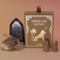 The Creative Imagination Incense Cones box next to two crystal pieces next to it with two incense cones in front of it.
