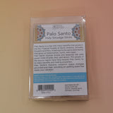 The back of the Holy Smudge Sticks - Pack of 6 4" Palo Santo Sticks on a pink and yellow background.