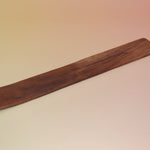 The Plain Wooden Incense Burner on a pink and yellow background.