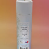 The back of the Bhavana Bamboo Infuser Traveler Tumbler container on a pink and yellow background.