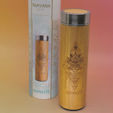 The Namaste Bhavana Bamboo Infuser Traveler Tumbler on a pink and yellow background.