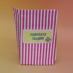 The 5 Dollar Blind Mystery Bag on a pink and orange background.