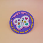 The Wake Up Grab A Brush Makeup SOAD Holographic Glitter Vinyl Sticker on a light pink background.