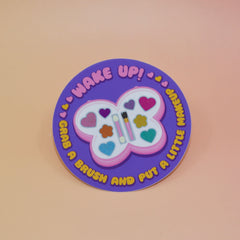 The Wake Up Grab A Brush Makeup SOAD Holographic Glitter Vinyl Sticker on a light pink background.