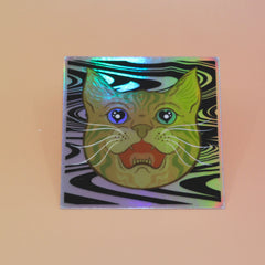 The Cozmik Love Cat 3" Holographic Vinyl Sticker on a light pink background.