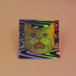 The Cozmik Love Cat 3" Holographic Vinyl Sticker on a light pink background.