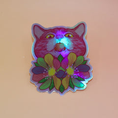 The Sapphic Flower Kitty 4" Holographic Vinyl Sticker on a light pink background.