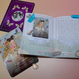 A card from the Seasons of the Witch - Litha Oracle Card Deck with its respectful page in the guidebook surrounded by crystals.
