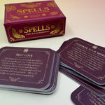 The Spells A Little Deck of Enchantment Spell Deck on a pink and yellow background, showing its contents.