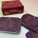 The Spells A Little Deck of Enchantment Spell Deck on a pink and yellow background, showing its contents.