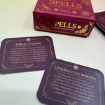 The Spells A Little Deck of Enchantment Spell Deck on a pink and yellow background, showing its contents.